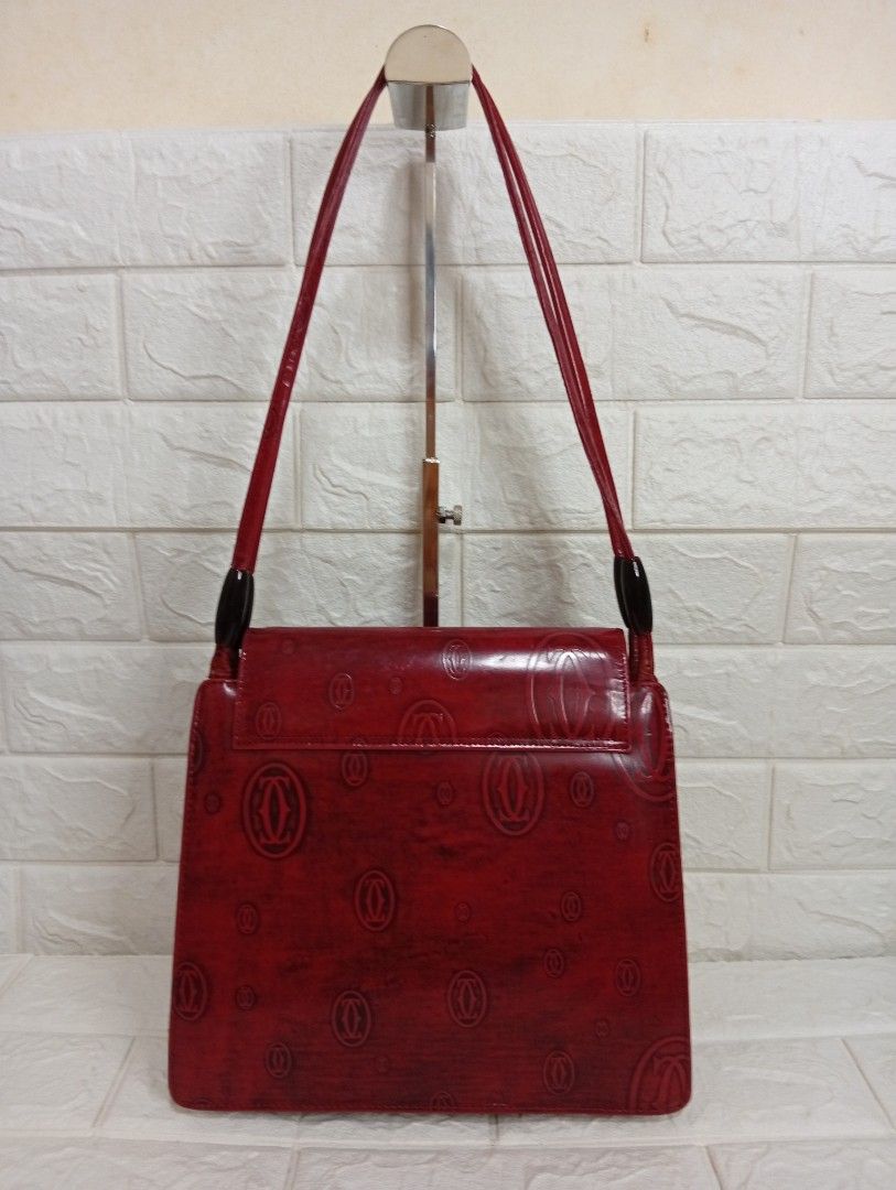 Vintage Cartier Monogram Shoulder Bag (Category: Shoulder Bags) located in Las Pinas. Submitted by etoksi1234 (Listing ID 1464200966, Image 2). Description: Pre-loved vintage Cartier "Happy Birthday" burgundy patent leather shoulder bag featuring an all-over debossed double-C logo pattern and a flap closure with a centered hardware clasp. .