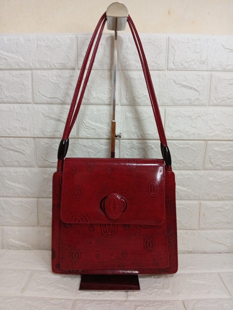Vintage Cartier Monogram Shoulder Bag (Category: Shoulder Bags) located in Las Pinas. Submitted by etoksi1234 (Listing ID 1464200966, Image 1). Description: Pre-loved vintage Cartier "Happy Birthday" burgundy patent leather shoulder bag featuring an all-over debossed double-C logo pattern and a flap closure with a centered hardware clasp. .