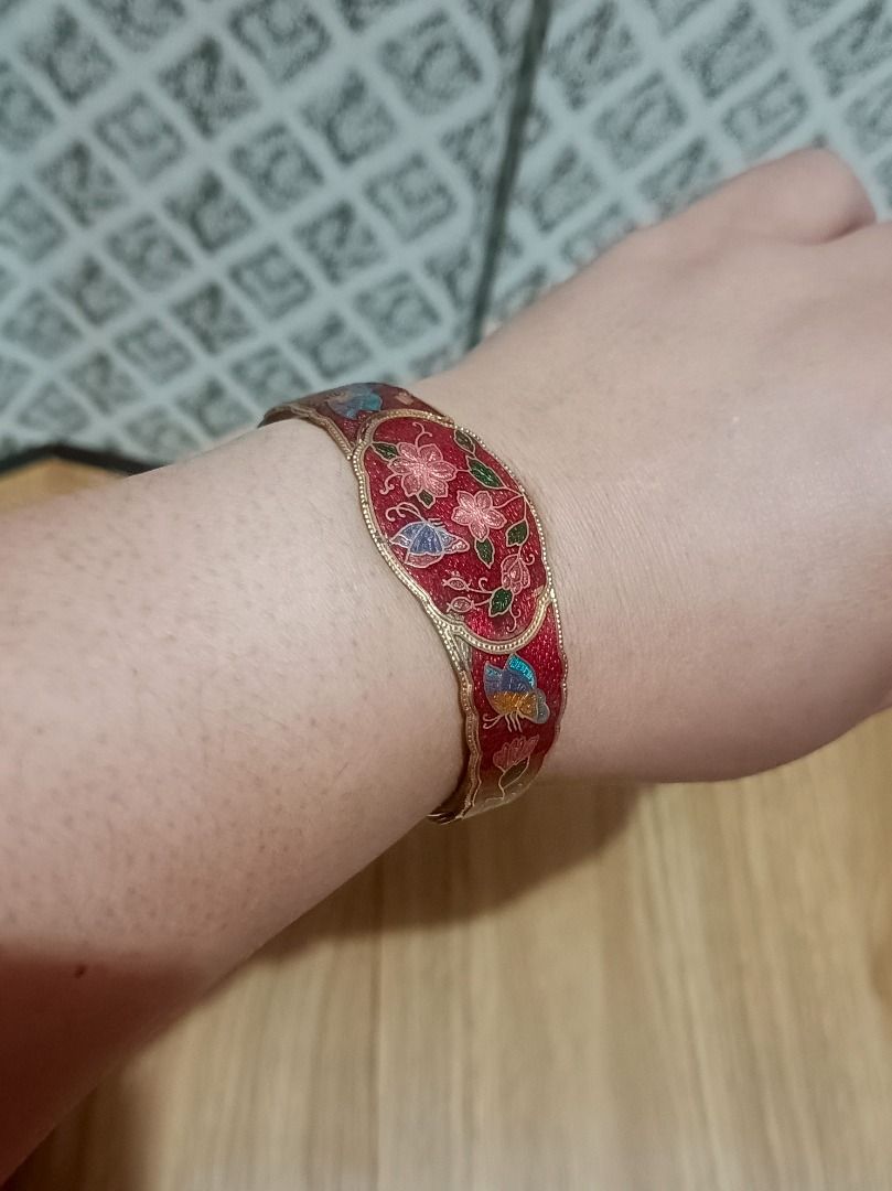 Vintage Cloisonne Flower Enamel Hinge Bangle Bracelet (Category: Bracelets) located in Makati City. Submitted by nyxhemera26 (Listing ID 1464315902, Image 1). Description: Vintage Cloisonne Flower Enamel Hinge Bangle Bracelet - Beautiful vintage bangle bracelet - Vibrant red enamel with colorful floral and butterfly motifs - Gold-tone metal - Secure hinged closure - Measures approximately 2.5 inches in diameter - Perfect for adding a pop of color