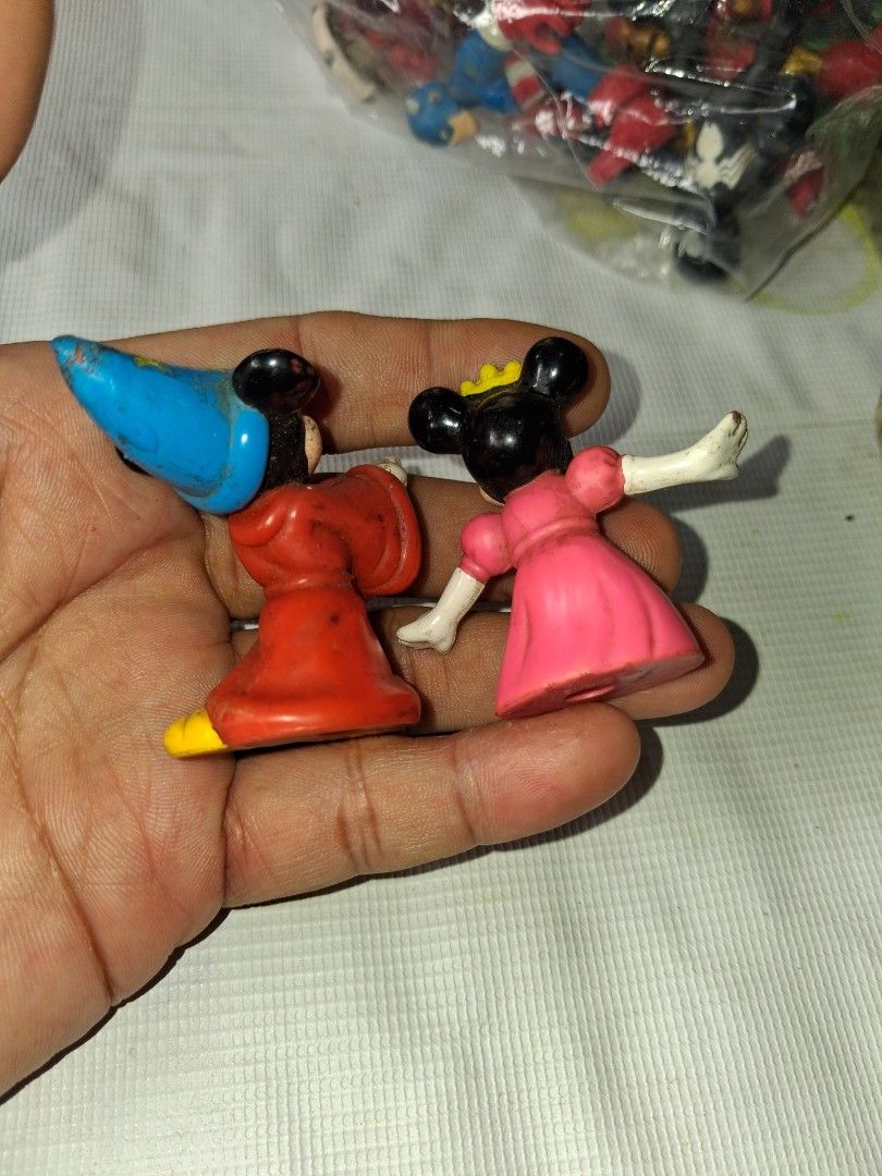 Vintage Disney Mickey & Minnie Mouse Figurines (Category: Figurines & Statues) located in Manila. Submitted by marcas022798212 (Listing ID 1464147355, Image 2). Description: - Vintage Mickey & Minnie Mouse figurines - Mickey: Sorcerer hat & red outfit - Minnie: Pink dress & crown - Classic Disney collectibles - Ideal for Disney fans' collections.