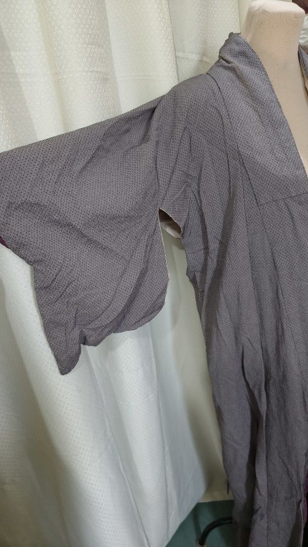 Vintage Grey Patterned Kimono Robe with Purple Lining (Category: Coats, Jackets and Outerwear) located in Taguig. Submitted by ymicloset (Listing ID 1464224007, Image 2). Description: - Elegant grey kimono robe - Features a subtle pattern - Contrasting purple lining and cuffs - Wide sleeves for a relaxed fit - Versatile: great for layering or as a standalone statement piece - Unique and eye-catching design -Shoulder 23 in -Waist 44 in -Length 58 