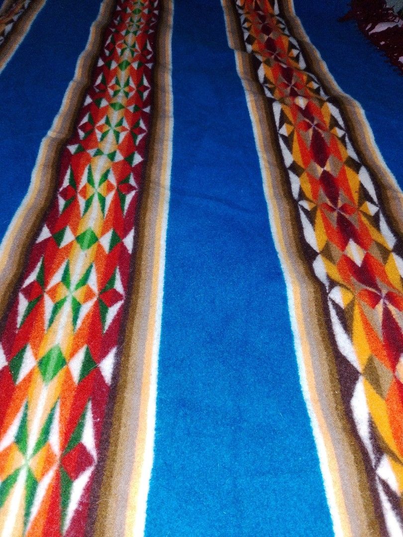 Vintage pendleton beaver state wool shawl blancket (Category: Luxury Apparel) located in Manila. Submitted by takeroshc143 (Listing ID 1464163555, Image 2). Description: Selling a beautiful and authentic Vintage Pendleton Woolen Mills "Beaver State" Shawl Blanket. This piece features a vibrant blue base with striking Native American-inspired geometric diamond/chevron stripes in orange, green, and brown.Size: Approx. 60" x 62" (Adult Square Shawl 
