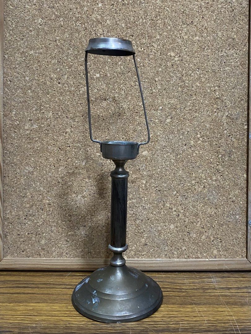 Vintage Style Metal Candle Holder (Category: Vintage Collectibles) located in Calamba. Submitted by chebvintagedepot (Listing ID 1464198364, Image 1). Description: [B16-02] This vintage-style metal candlestick holder has a stepped round base, slender columnar stem, and an open cup socket at the top with a wired shade holder frame. The metal has a dark, aged patinated finish that gives the piece a classic look. Its simple form works well for displ
