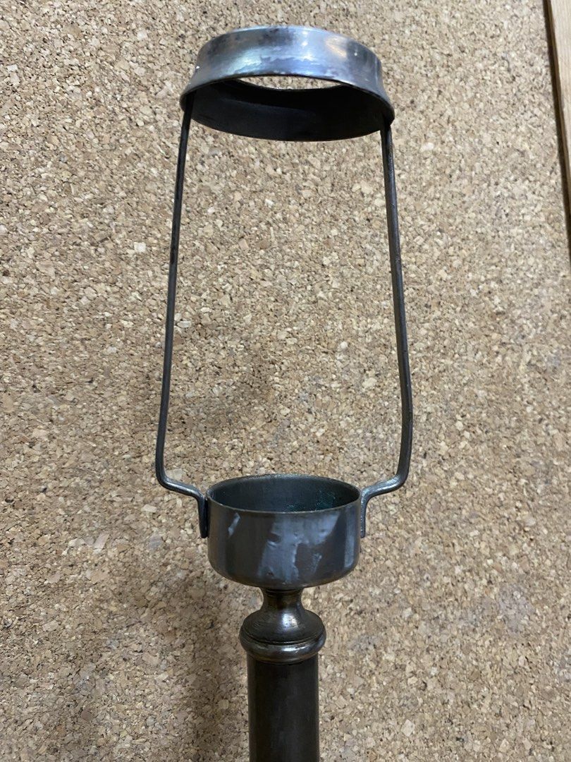Vintage Style Metal Candle Holder (Category: Vintage Collectibles) located in Calamba. Submitted by chebvintagedepot (Listing ID 1464199232, Image 3). Description: [B16-03] This vintage-style metal candlestick holder has a stepped round base, slender columnar stem, and an open cup socket at the top with a wired shade holder frame. The metal has a dark, aged patinated finish that gives the piece a classic look. Its simple form works well for displ