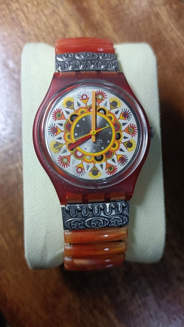 Vintage Swatch Curry Powder (Category: Luxury Watches) located in Quezon City. Submitted by unusual_knicknacks (Listing ID 1464147259, Image 1). Description: - Unique Swatch watch - Red and orange beaded bracelet - Colorful, intricate watch face pattern - Stretchy and comfortable bracelet - Perfect statement piece for any outfit.