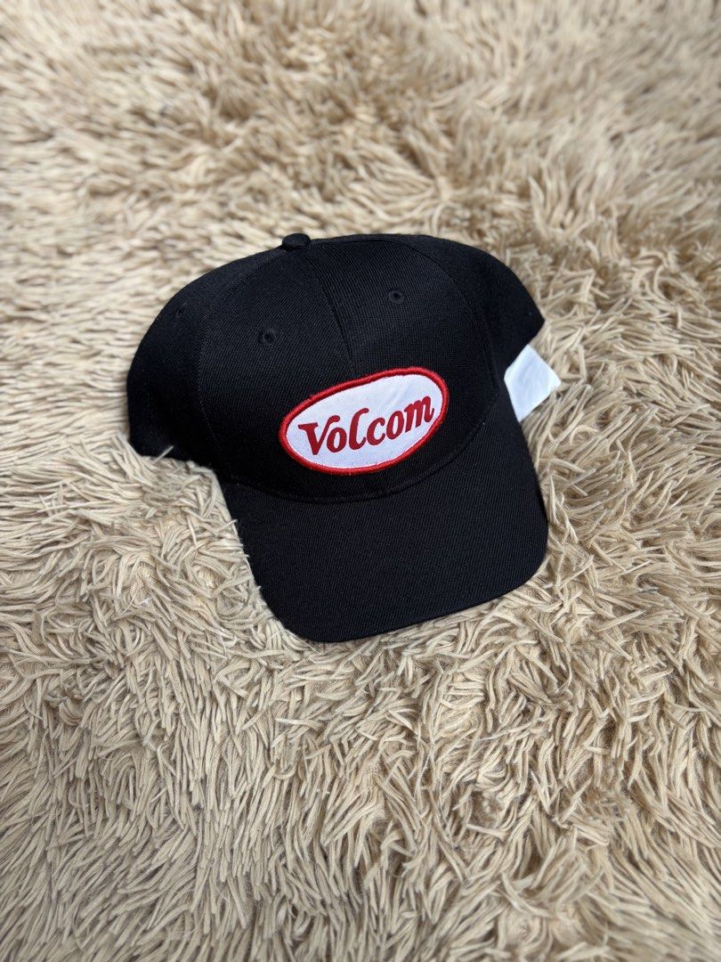Volcom Black Baseball Cap (Category: Caps & Hats) located in Quezon City. Submitted by nojthrift (Listing ID 1464252292, Image 1). Description: - Classic black Volcom cap - Features iconic oval logo patch on the front - Adjustable snapback closure for a custom fit - One size fits most - Ideal for everyday wear and adding a stylish touch to any outfit.