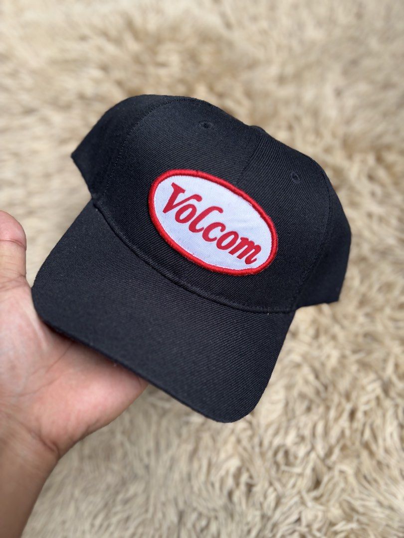 Volcom Black Baseball Cap (Category: Caps & Hats) located in Quezon City. Submitted by nojthrift (Listing ID 1464252292, Image 2). Description: - Classic black Volcom cap - Features iconic oval logo patch on the front - Adjustable snapback closure for a custom fit - One size fits most - Ideal for everyday wear and adding a stylish touch to any outfit.