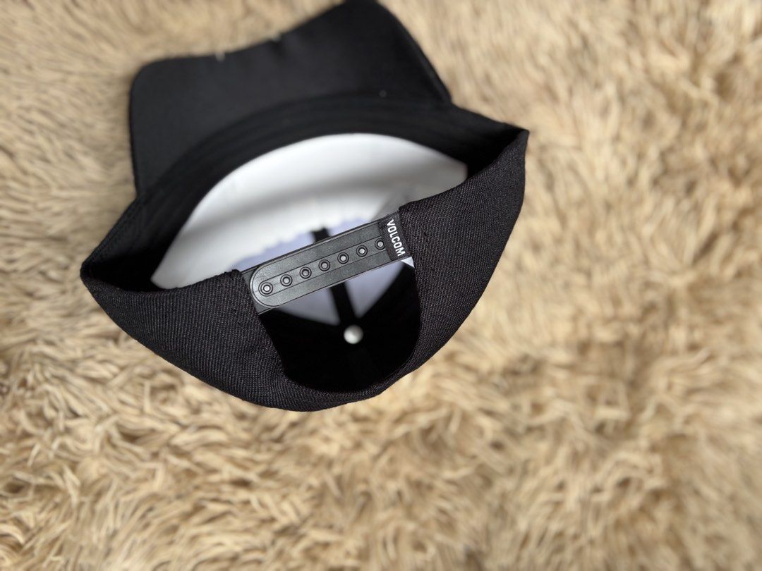 Volcom Black Baseball Cap (Category: Caps & Hats) located in Quezon City. Submitted by nojthrift (Listing ID 1464252292, Image 3). Description: - Classic black Volcom cap - Features iconic oval logo patch on the front - Adjustable snapback closure for a custom fit - One size fits most - Ideal for everyday wear and adding a stylish touch to any outfit.