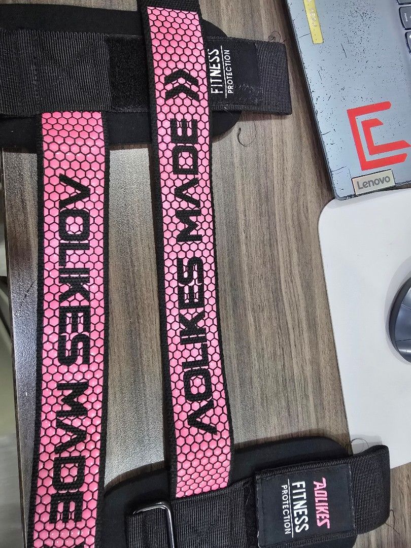 Weightlifting Straps Wrist Support (Category: Weights & Dumbbells) located in Manila. Submitted by arkitektonggala (Listing ID 1464141883, Image 2). Description: - AOLIKES weightlifting straps for fitness protection and wrist support. - Stylish pink color with a honeycomb pattern. - Features adjustable velcro for a secure and customized fit. - Ideal for lifting heavy weights and enhancing workout performance. - "AOLIKES MADE" logo for authenticit