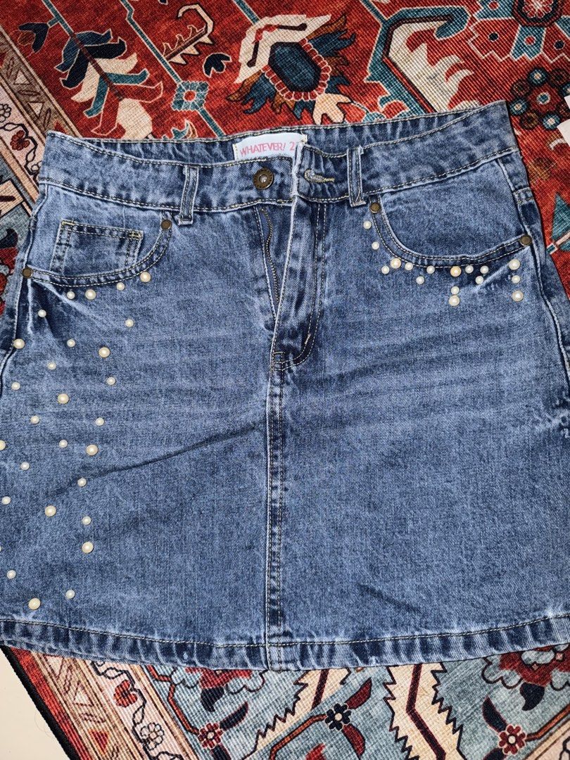 WHATEVER! Pearl Embellished Denim Mini Skirt (Category: Skirts) located in Manila. Submitted by hihiyana (Listing ID 1464295942, Image 1). Description: - Blue denim mini skirt - Pearl embellishments on front pockets and hem - Distressed details on back pockets - Button and zip closure - Estimated size S/M - Ideal for casual wear W 27-29.