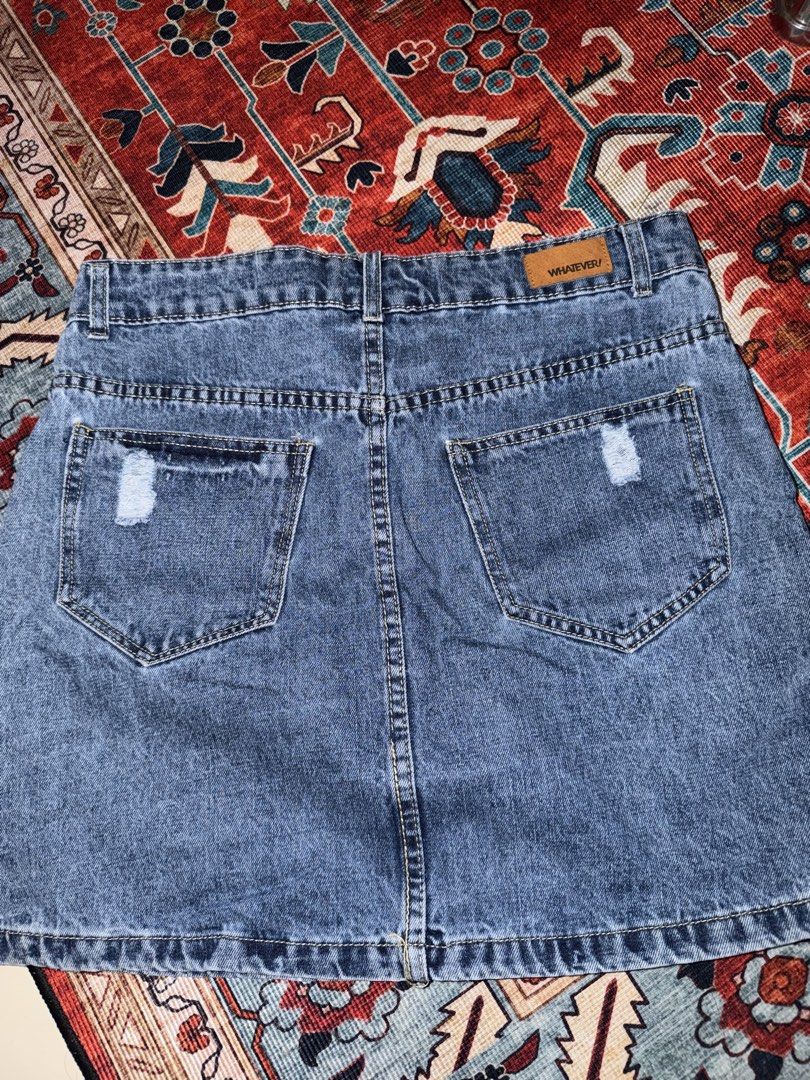 WHATEVER! Pearl Embellished Denim Mini Skirt (Category: Skirts) located in Manila. Submitted by hihiyana (Listing ID 1464295942, Image 2). Description: - Blue denim mini skirt - Pearl embellishments on front pockets and hem - Distressed details on back pockets - Button and zip closure - Estimated size S/M - Ideal for casual wear W 27-29.
