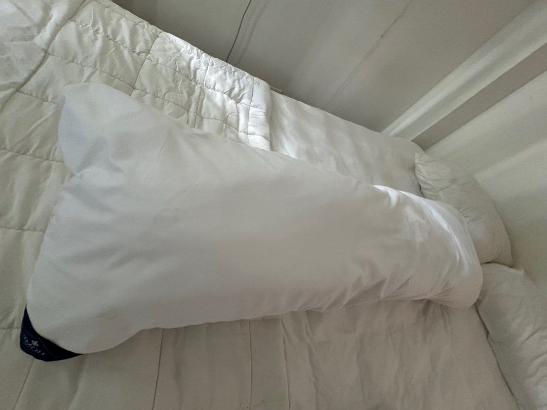 White Bolster Pillow (Category: Bedding & Towels) located in Manila. Submitted by decluterthings888 (Listing ID 1464337431, Image 1). Description: - Long white bolster pillow - Ideal for sleeping or lounging - Removable cover for easy washing - Soft and comfortable feel - Approximately 100cm in length - Selling as I have too many pillows.