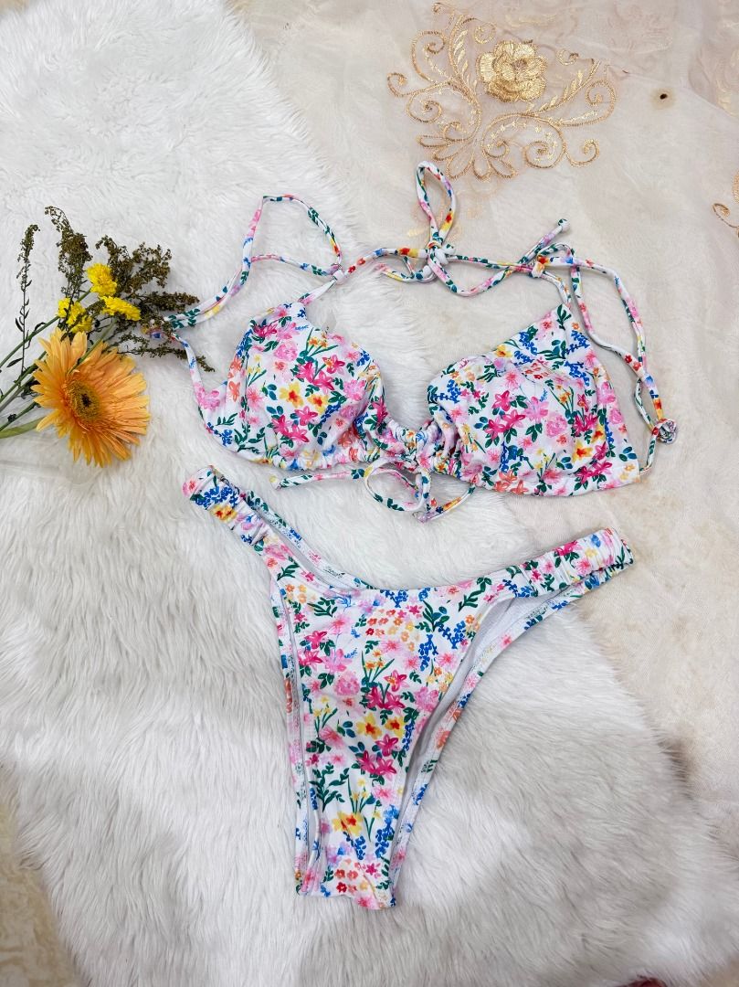 White Floral Two Piece Swimsuit (Category: Bikinis & Swimsuits) located in Mandaluyong City. Submitted by prelovedbyrinoa_ (Listing ID 1464349917, Image 1). Description: Cute and versatile swimsuit, perfect for beach days, pool trips, and vacations! 🌴✨ • Padded cups • Stylish & comfy fit • Brand new • Good condition.