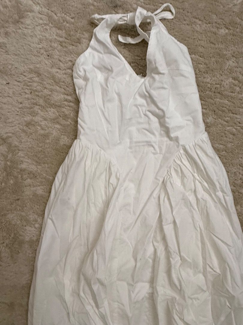 White Halter Neck Maxi Dress (Category: Dresses) located in Caloocan City. Submitted by croissant8765 (Listing ID 1464314742, Image 3). Description: - White maxi dress - Halter neck tie - Fitted bodice with flowy skirt - Ideal for summer occasions or beach vacations - Easy to dress up or down - Comfortable and breezy fabric.