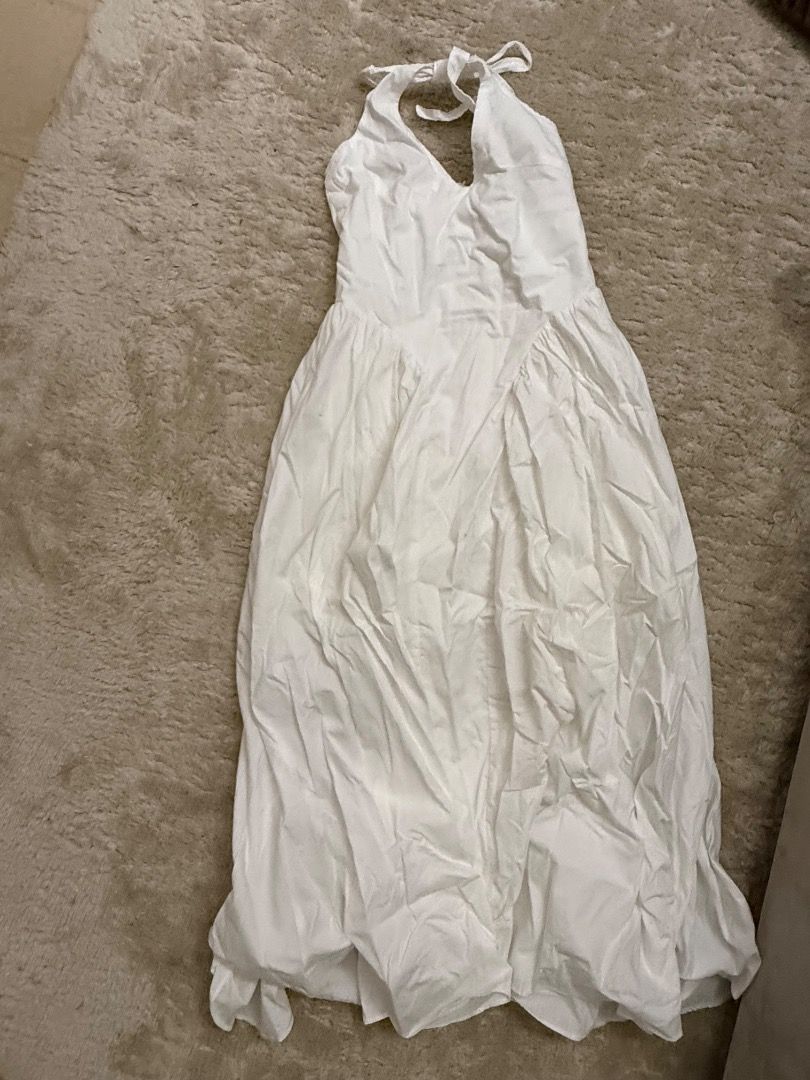 White Halter Neck Maxi Dress (Category: Dresses) located in Caloocan City. Submitted by croissant8765 (Listing ID 1464314742, Image 2). Description: - White maxi dress - Halter neck tie - Fitted bodice with flowy skirt - Ideal for summer occasions or beach vacations - Easy to dress up or down - Comfortable and breezy fabric.