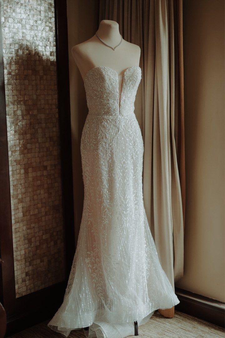White Label - Wedding Gown (Bernice) (Category: Evening dresses & gowns) located in Makati City. Submitted by mewikitkat (Listing ID 1464251645, Image 1). Description: ✨ Trumpet Style ✨ Fully beaded ✨ Fits small to medium frame ✨ Used once in January 2026 ✨Already dry cleaned ✨Purchased in December 2024 for 75,000 (Original Price 94,000) 🩵 Negotiable 🩵.