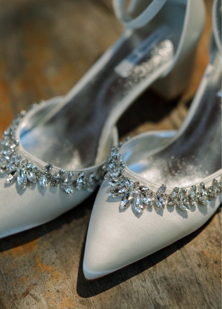 White Satin Heels with Rhinestone Embellishment (Category: Heels) located in Balanga. Submitted by chelby23 (Listing ID 1464263878, Image 1). Description: - White satin heels - with box - Pointed toe - Delicate rhinestone trim along the edge - Secure ankle strap closure - Comfortable block heel - Ideal for weddings and special occasions - worn once only on my wedding.