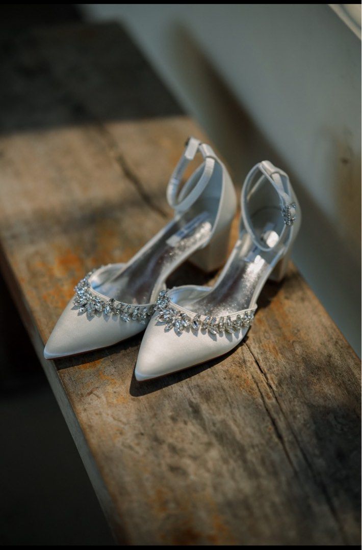 White Satin Heels with Rhinestone Embellishment (Category: Heels) located in Balanga. Submitted by chelby23 (Listing ID 1464263878, Image 2). Description: - White satin heels - with box - Pointed toe - Delicate rhinestone trim along the edge - Secure ankle strap closure - Comfortable block heel - Ideal for weddings and special occasions - worn once only on my wedding.