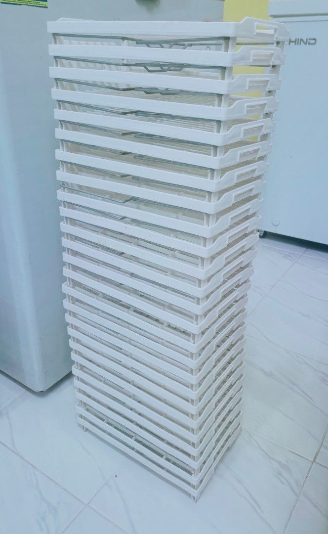 White Stackable Storage Rack Shelf Unit (Category: Shelves, Cabinets & Racks) located in Subang Jaya. Submitted by nadia_anessa (Listing ID 1464246103, Image 1). Description: - Stackable white plastic storage rack - Grid pattern on each shelf - Perfect for organizing items at home or in the office - Versatile for various storage needs ‼️Take all (25pcs) RM40 only‼️ .