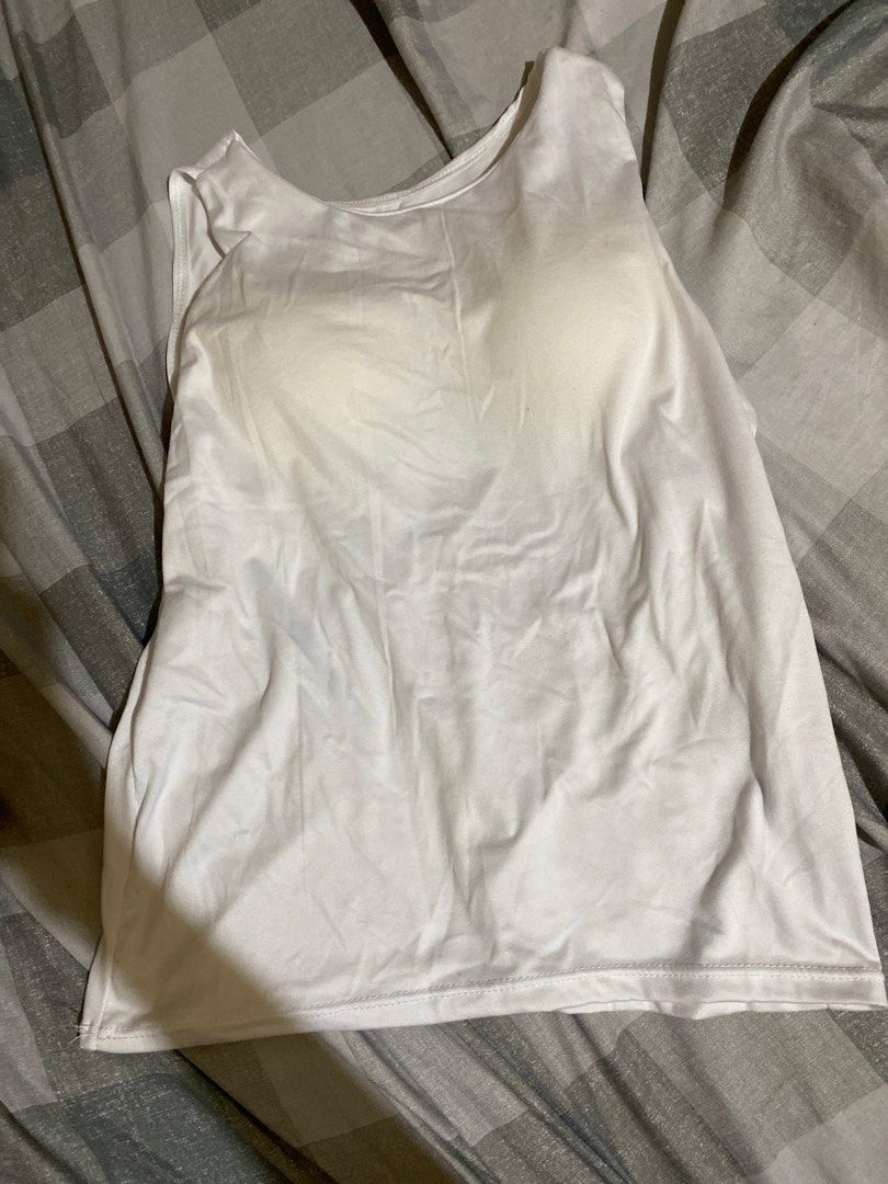 White Tank Top with Built-in Bra (Category: Sleeveless) located in San Fernando. Submitted by kimaijoo (Listing ID 1464155809, Image 1). Description: - White tank top with integrated bra - Made from soft, comfortable fabric - Sleeveless design for freedom of movement - Versatile: wear alone or as a base layer - Easy to wash and maintain - Ideal for casual outings, lounging, or workouts.