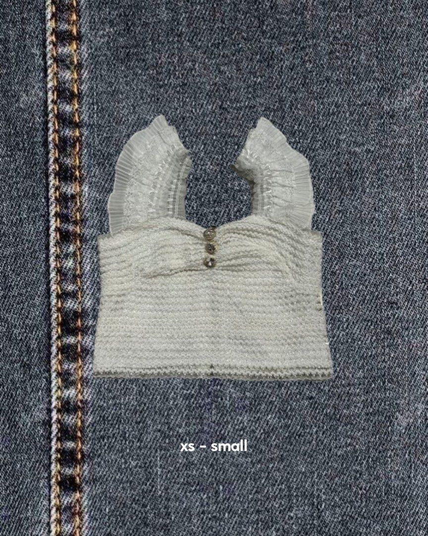 White Textured Crop Top with Ruffle Sleeves (Category: Sleeveless) located in Caloocan City. Submitted by zeal_aekigai (Listing ID 1464341373, Image 1). Description: Cute white textured crop top with ruffle sleeves and front buttons. Fits XS-S..