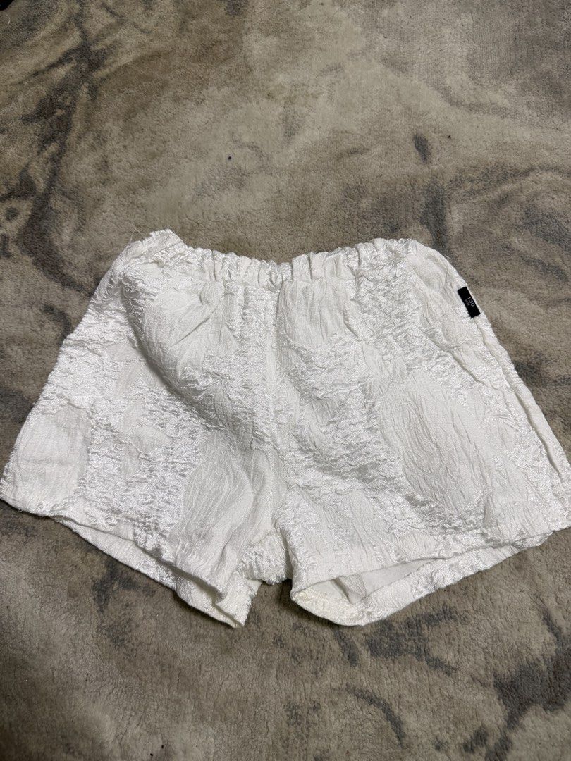 White Textured Shorts (Category: Babies & Kids Fashion) located in Manila. Submitted by e.louise (Listing ID 1464332346, Image 1). Description: - White textured shorts - Comfortable elastic waistband - Unique crinkled fabric look - Ideal for everyday casual wear - Easy to pair with any top.