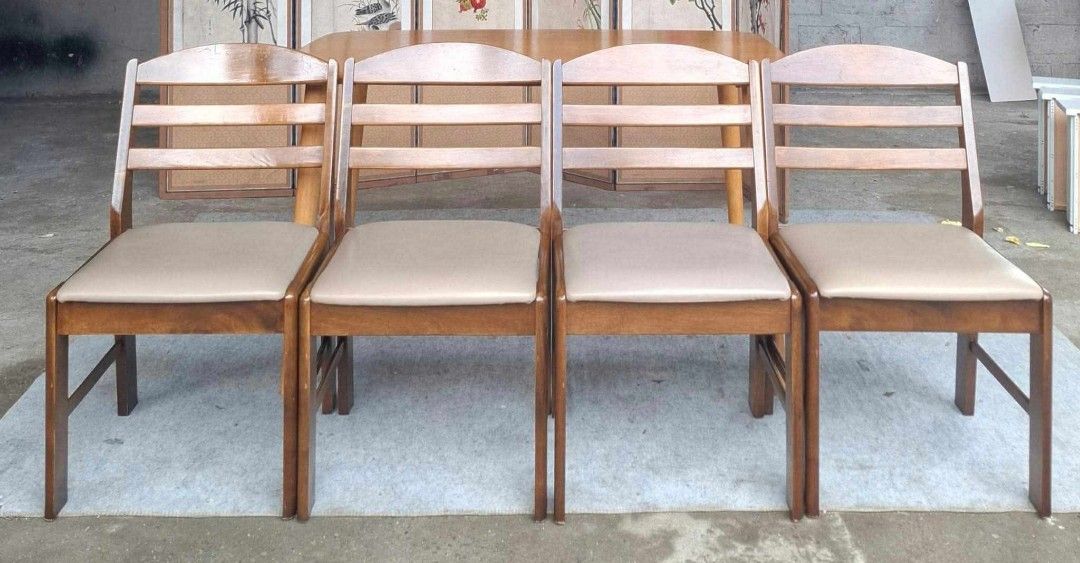 Wooden Dining Table and 4 Chairs Set (Category: Tables & Sets) located in Antipolo. Submitted by roselle001 (Listing ID 1464218654, Image 2). Description: - Light wood dining table with a smooth, rounded corner design. - Comes with 4 matching chairs in a darker wood finish. - Chairs feature comfortable light beige cushioned seats. - Elegant slatted back design on the chairs. - Angled table legs for a modern aesthetic. - Perfect for compact dining