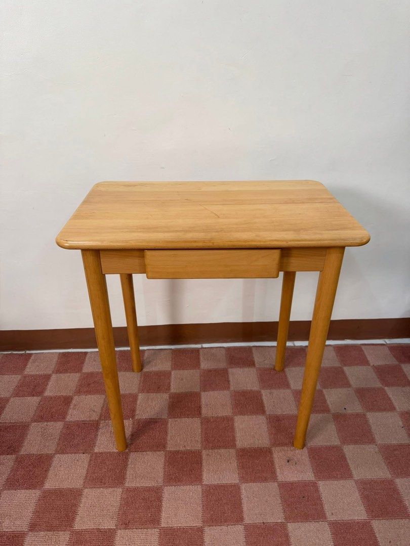 Wooden Study Desk with Drawer (Category: Tables & Sets) located in Quezon City. Submitted by inamocha (Listing ID 1464324020, Image 3). Description: - Simple wooden desk with a light, natural finish. - Features one convenient storage drawer. - Stylish tapered legs for a modern look. - Ideal for study areas or compact workspaces..