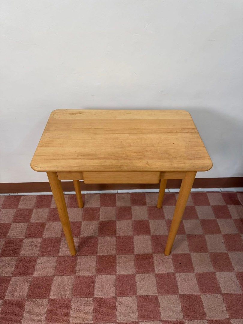 Wooden Study Desk with Drawer (Category: Tables & Sets) located in Quezon City. Submitted by inamocha (Listing ID 1464324020, Image 1). Description: - Simple wooden desk with a light, natural finish. - Features one convenient storage drawer. - Stylish tapered legs for a modern look. - Ideal for study areas or compact workspaces..