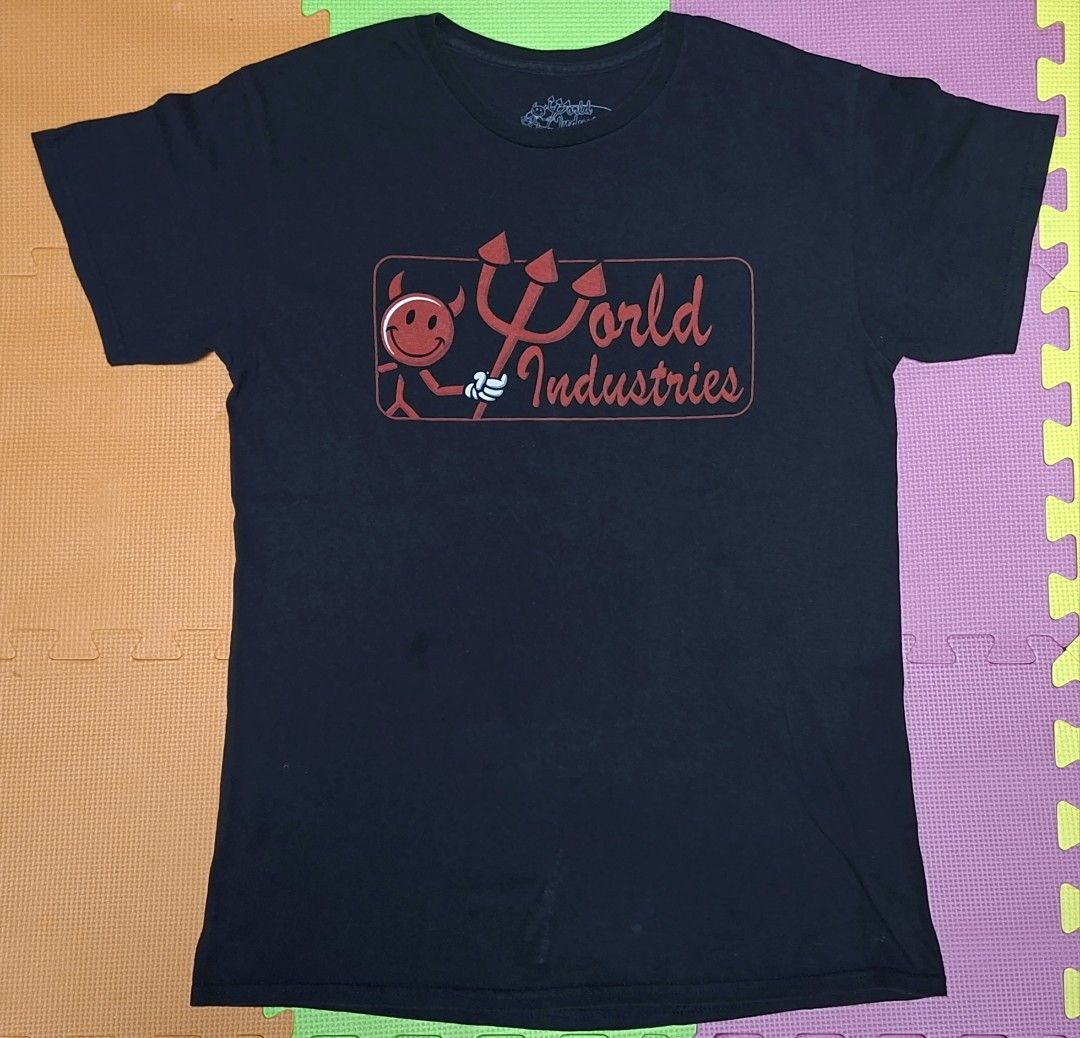 World Industries Devil T-Shirt (Category: Tshirts & Polo Shirts ) located in Manila. Submitted by declutrredgoods (Listing ID 1464283352, Image 1). Description: - Classic black tee from World Industries - Features iconic devil logo graphic on the front - Short sleeves and crew neck - Perfect for casual wear - Shows some signs of wear.