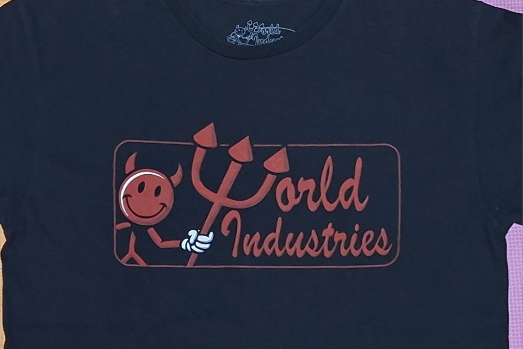 World Industries Devil T-Shirt (Category: Tshirts & Polo Shirts ) located in Manila. Submitted by declutrredgoods (Listing ID 1464283352, Image 2). Description: - Classic black tee from World Industries - Features iconic devil logo graphic on the front - Short sleeves and crew neck - Perfect for casual wear - Shows some signs of wear.