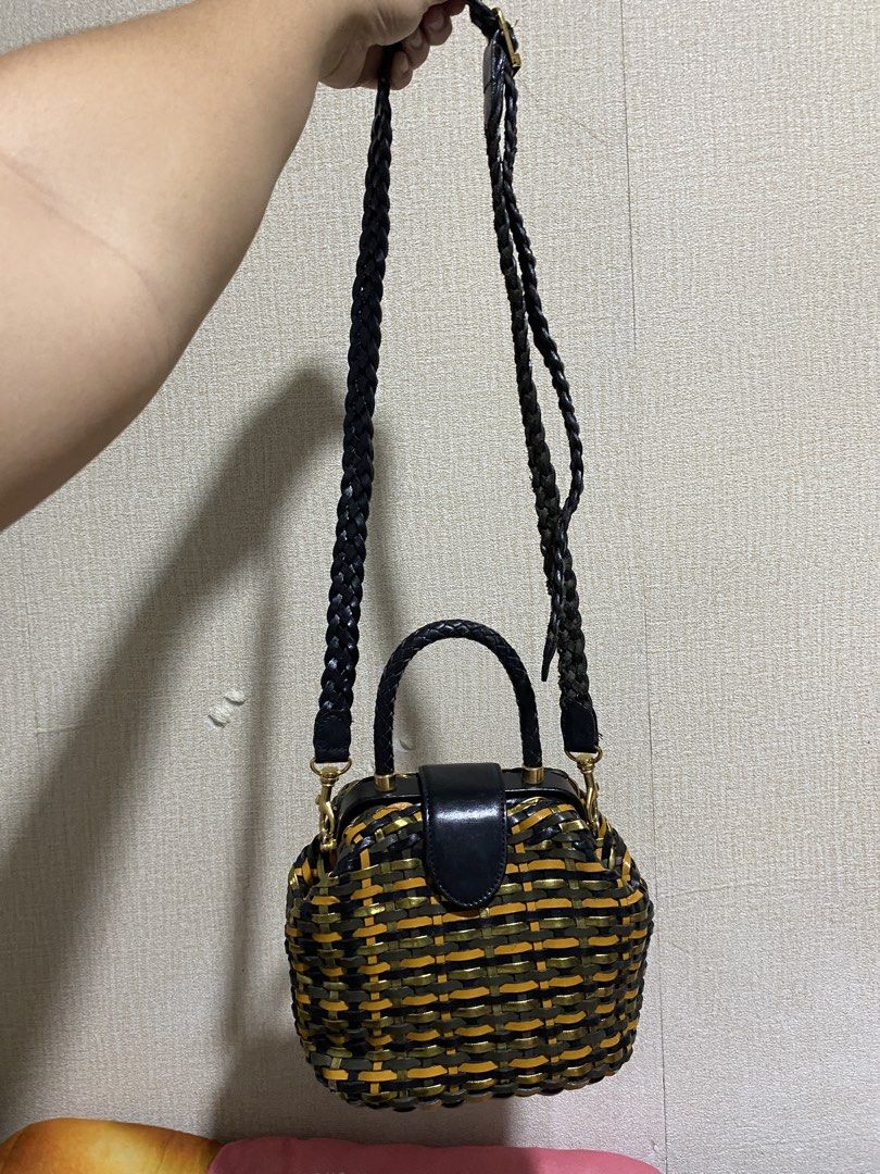 Woven Leather Handbag with Paisley Lining (Category: Shoulder Bags) located in Manila. Submitted by cdb_22 (Listing ID 1464190119, Image 2). Description: - Unique woven design with black, gold, and orange stripes. - Braided black leather top handles. - Detachable braided strap for versatile carrying. - Interior features a cool paisley pattern lining. - Includes an internal zippered pocket for essentials. - Secure closure with a black leather flap