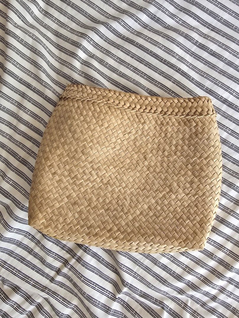 Woven Straw Clutch Bag (Category: Clutches) located in Paranaque City. Submitted by incognitopawikan (Listing ID 1464157841, Image 1). Description: - Natural woven straw clutch - Braided detail along the side - Simple and chic design - Ideal for casual outings or beach trips - Spacious enough for essentials - Lightweight and easy to carry.