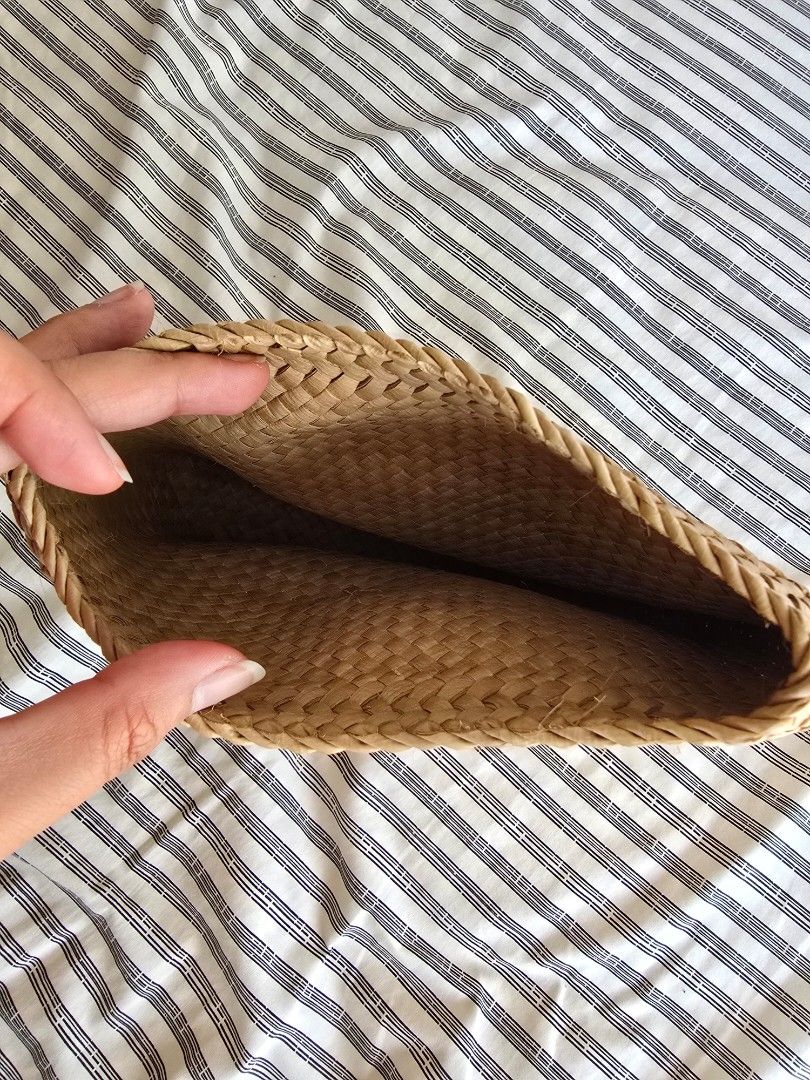 Woven Straw Clutch Bag (Category: Clutches) located in Paranaque City. Submitted by incognitopawikan (Listing ID 1464157841, Image 2). Description: - Natural woven straw clutch - Braided detail along the side - Simple and chic design - Ideal for casual outings or beach trips - Spacious enough for essentials - Lightweight and easy to carry.