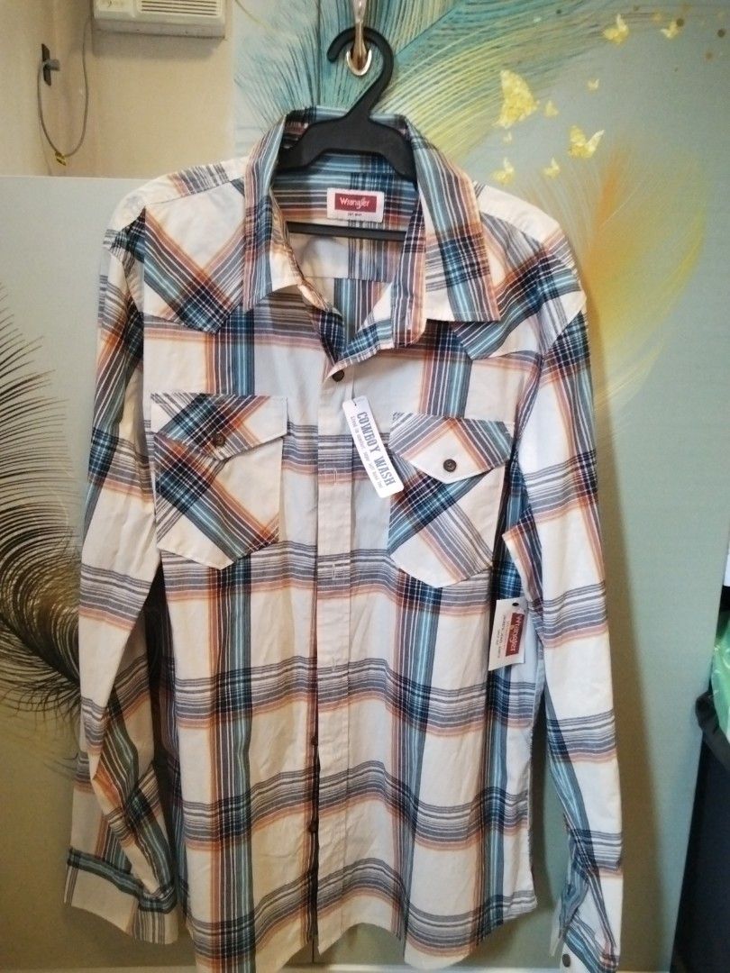 Wrangler Men's long sleeve polo (Category: Tshirts & Polo Shirts ) located in Calasiao. Submitted by alluringvenus.thriftshop (Listing ID 1464159257, Image 1). Description: Wrangler Men's long sleeve polo brand new with tags.