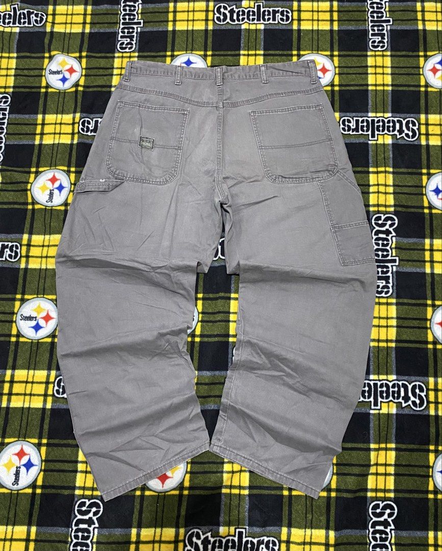 WRANGLER,Carpenter workwear pants (Category: Jeans) located in Cavite. Submitted by jc_thrift95 (Listing ID 1464213801, Image 2). Description: - a pair of Wrangler relaxed-fit gray canvas carpenter workwear pants featuring classic utility pockets and a wide-leg silhouette. - Made in Mexico - Color rate 8/10 - See pictures details for dimes. - L- 39 inch - W- 17 inch.