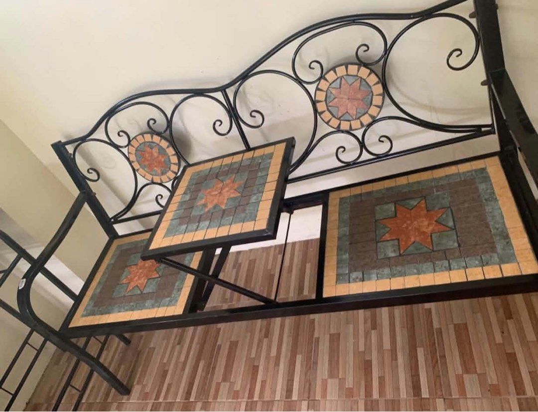 Wrought Iron Bench with Mosaic Table Top (Category: Tables & Sets) located in Manila. Submitted by d_carthub (Listing ID 1464165387, Image 1). Description: - Unique wrought iron bench - Decorative mosaic tabletop with earthy tones (brown, green, orange) - Intricate scrollwork on backrest - Starburst patterns on mosaic tiles - Adds charming, vintage feel - Suitable for indoor or outdoor spaces - Sturdy construction.