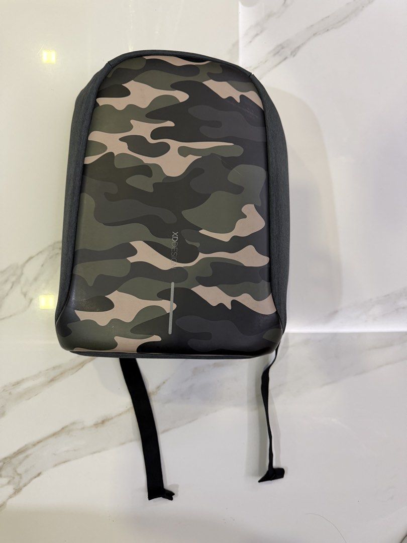 XDDESIGN Anti-Theft Backpack Camouflage (Category: Backpacks) located in Makati City. Submitted by monkeykingo (Listing ID 1464141951, Image 1). Description: - XDDESIGN Camouflage Anti-Theft Backpack - Built-in USB charging port - Multiple internal compartments for organization - Padded shoulder straps and back panel for enhanced comfort - Ideal for daily commutes and travel.