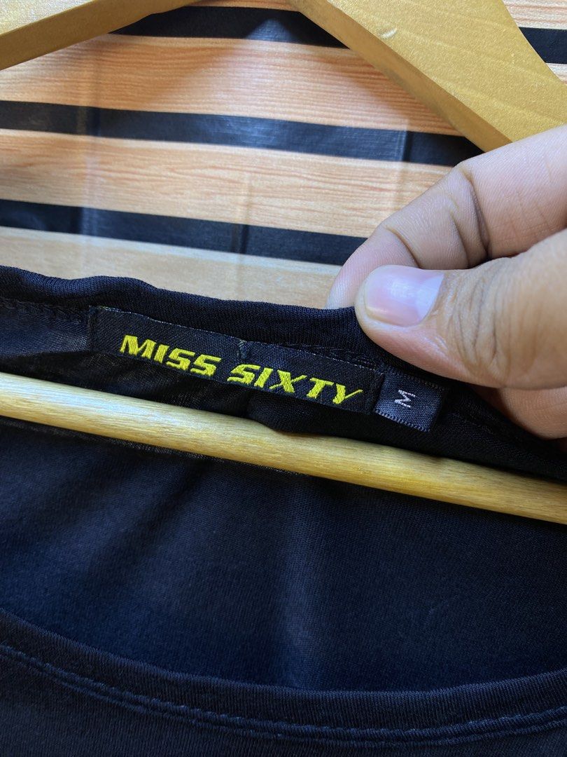 Y2k Miss Sixty (Category: Shirts) located in Makati City. Submitted by drip.poww (Listing ID 1464192997, Image 3). Description: - Authentic Miss Sixty - Color: Black - Size: Small - Dimes: 17x26 - Authentic - Excellent condition - Need wash, fresh from bale - Material: 100% Cotton Please don’t expect too much—these are thrifted (ukay) items. 😊 !!STILL NEGOTIABLE!!.