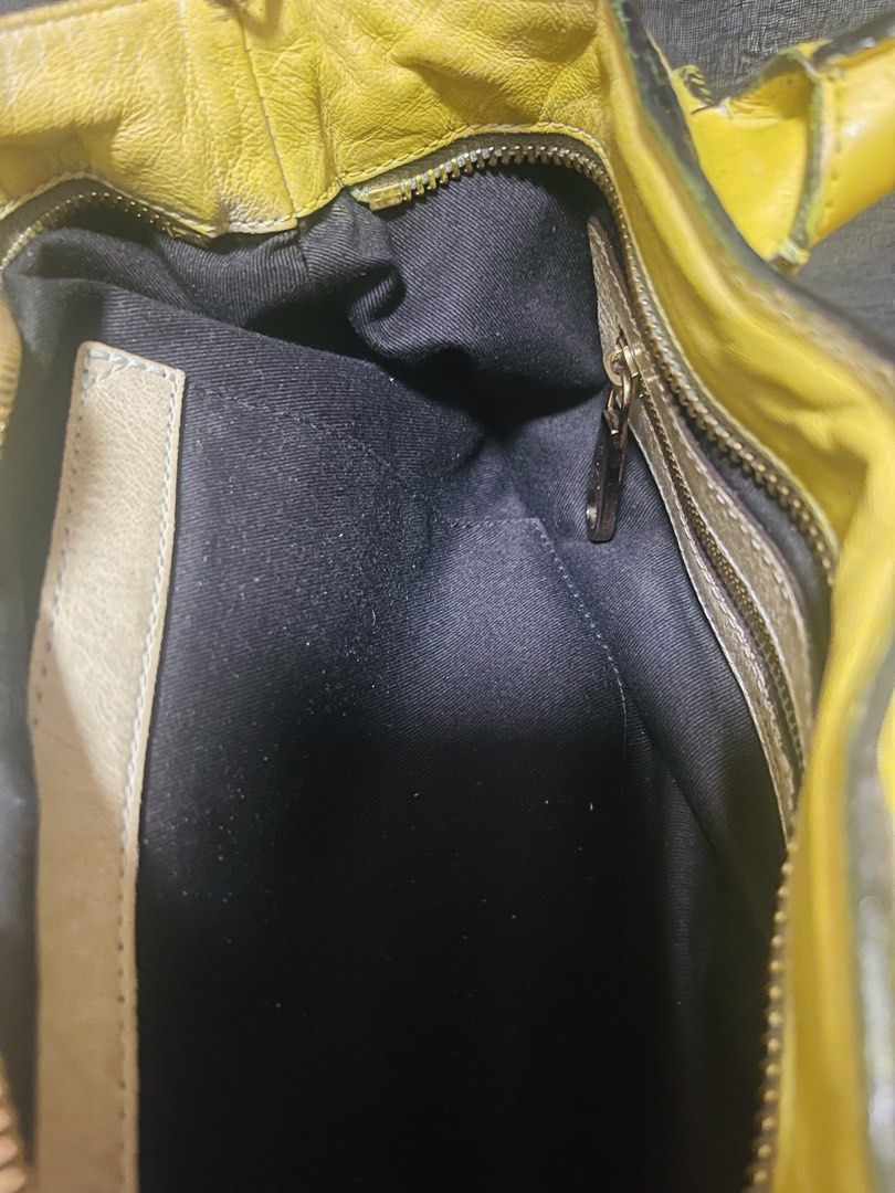 Chloe Yellow Leather Handbag with Scarf Accent (Category: Shoulder Bags) located in Manila. Submitted by ermenchita71969 (Listing ID 1464218123, Image 3). Description: - Bright yellow leather handbag - Features brown leather handles - Gold-tone hardware - Black fabric interior lining - Includes a colorful scarf tied to the handle - Plenty of interior space for essentials - Ideal for everyday use - Repainted - Missing strap - With certificate of A