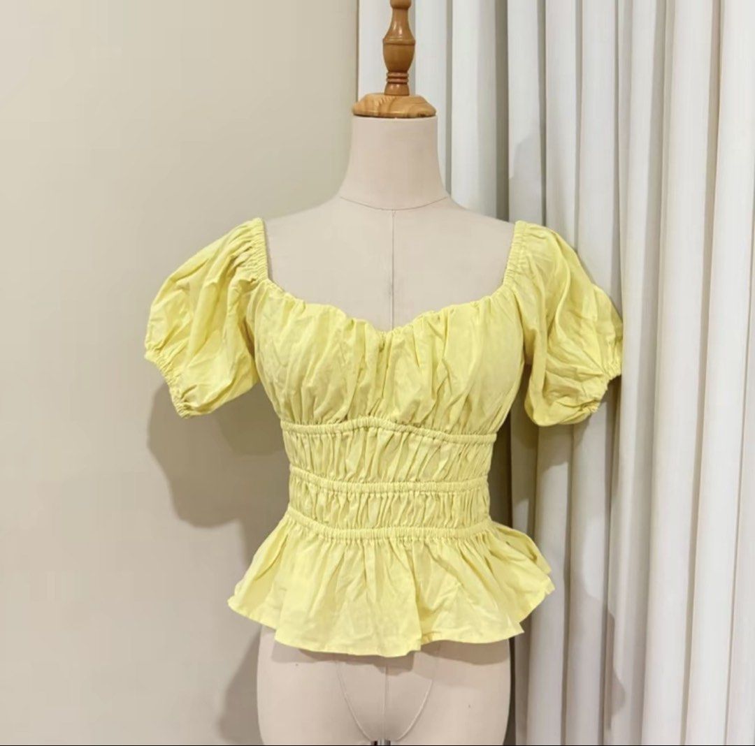 Yellow Puff Sleeve Smocked Peplum Top (Category: Blouses) located in Legazpi City. Submitted by sandras. (Listing ID 1464177432, Image 1). Description: - Adorable yellow top - Features puff sleeves - Sweetheart neckline - Smocked waist for a flattering fit - Peplum hem for added flair - Perfect for dressing up or down - Easily pairs with jeans or skirts.