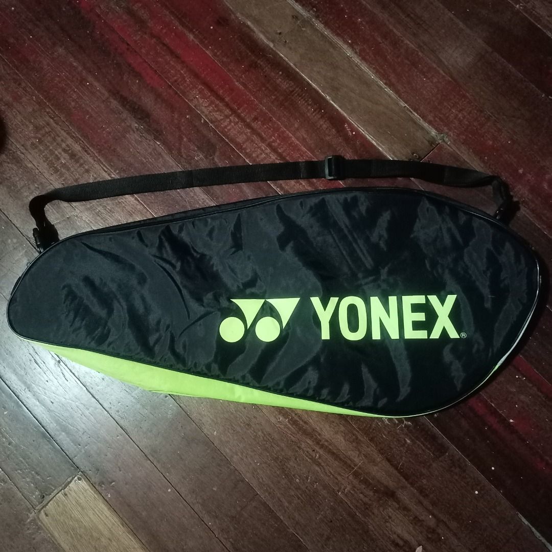 Yonex Badminton Bag (Category: Racket and Ball Sports) located in Cavite. Submitted by kurtgg.what (Listing ID 1464243146, Image 2). Description: Great condition!! though may stains lang, removable naman, labahan nyo nalang lalamove courier po ang pref kasi pag sa j&t baka masira po sya if tinupi. - Black and lime green Yonex bag - Multiple zippered compartments for storage - Adjustable shoulder strap - Ideal for badminton rackets and accessories
