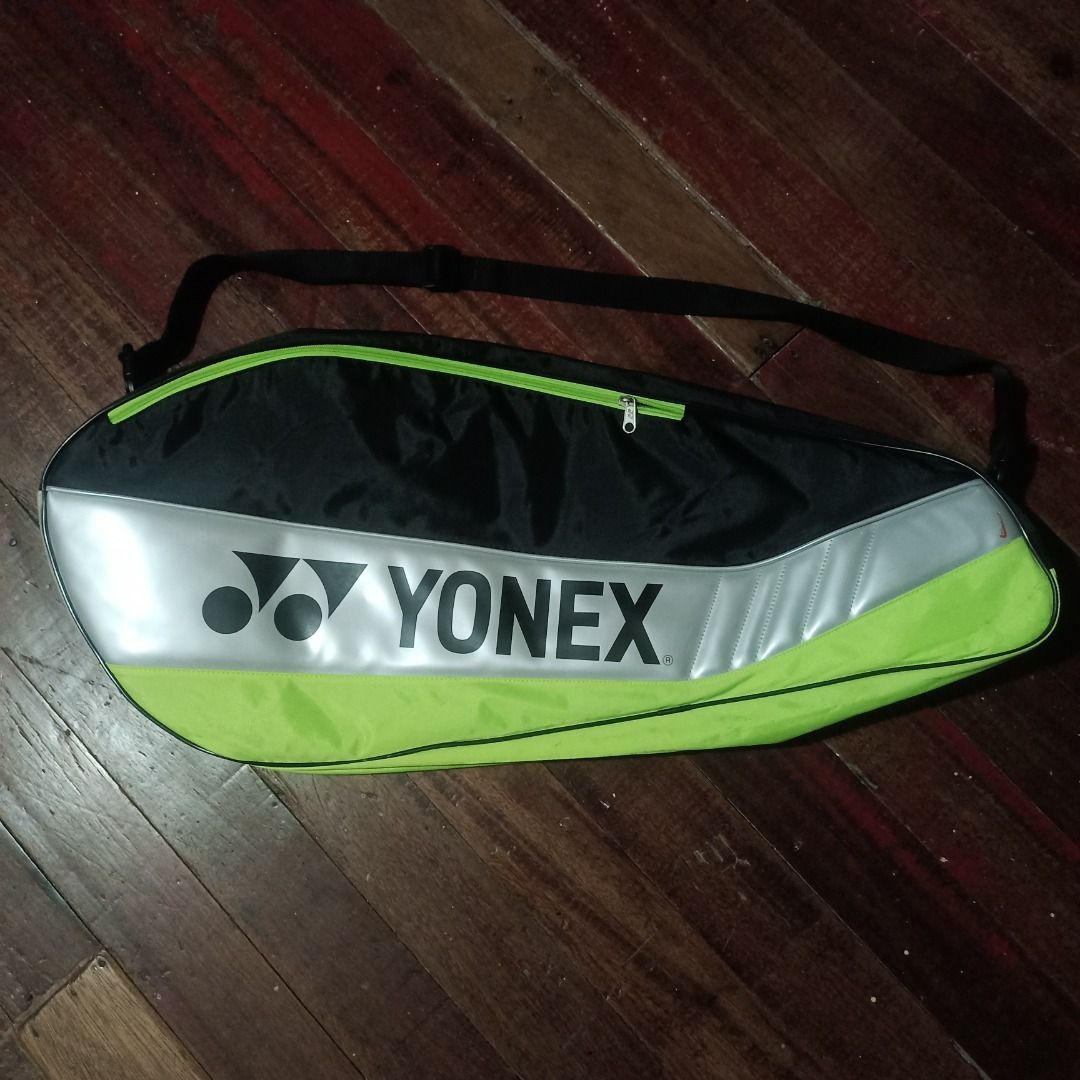 Yonex Badminton Bag (Category: Racket and Ball Sports) located in Cavite. Submitted by kurtgg.what (Listing ID 1464243146, Image 1). Description: Great condition!! though may stains lang, removable naman, labahan nyo nalang lalamove courier po ang pref kasi pag sa j&t baka masira po sya if tinupi. - Black and lime green Yonex bag - Multiple zippered compartments for storage - Adjustable shoulder strap - Ideal for badminton rackets and accessories
