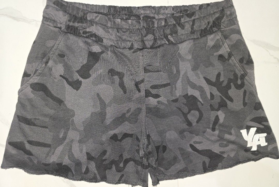 YoungLA Camo Gym Shorts (Category: Activewear) located in La Trinidad. Submitted by odin21 (Listing ID 1464222916, Image 1). Description: - Brand: YoungLA - Color: Grey Camouflage - Features: Elastic waistband with drawstring - Pockets: Two side pockets, one back pocket - Design: Raw hem detail - Versatile: Ideal for workouts or casual wear.