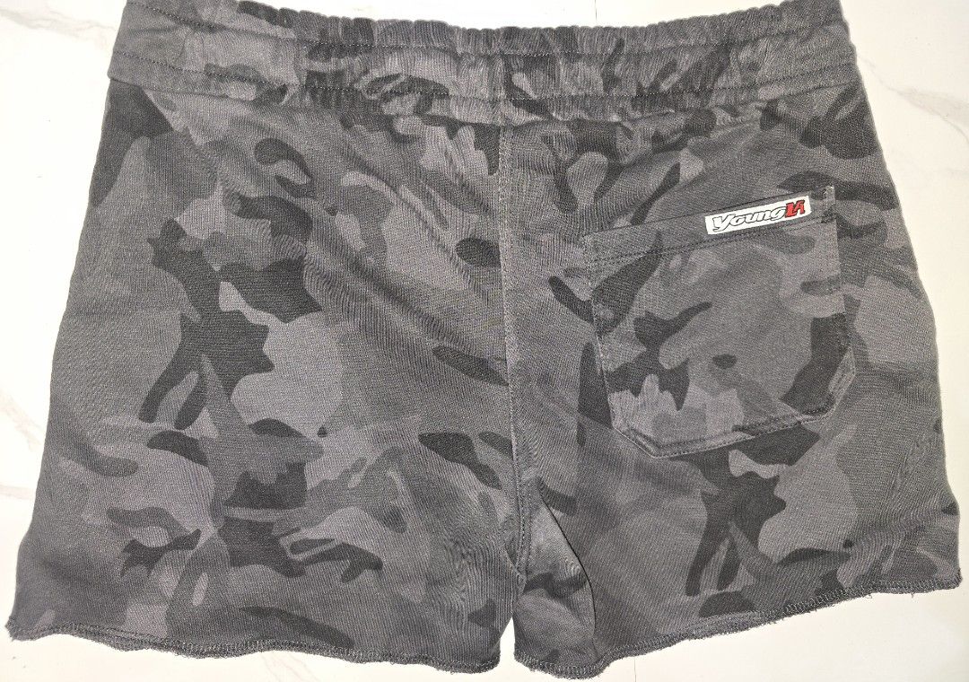 YoungLA Camo Gym Shorts (Category: Activewear) located in La Trinidad. Submitted by odin21 (Listing ID 1464222916, Image 2). Description: - Brand: YoungLA - Color: Grey Camouflage - Features: Elastic waistband with drawstring - Pockets: Two side pockets, one back pocket - Design: Raw hem detail - Versatile: Ideal for workouts or casual wear.