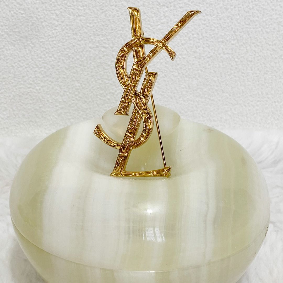 YSL Gold Lightly Textured 3D Effect Brooch (Category: Brooches) located in Cebu City. Submitted by posh_avenue888 (Listing ID 1464305259, Image 2). Description: In excellent condition. From Hong Kong. 3 inches. .