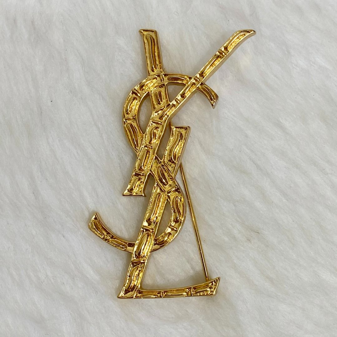 YSL Gold Lightly Textured 3D Effect Brooch (Category: Brooches) located in Cebu City. Submitted by posh_avenue888 (Listing ID 1464305259, Image 3). Description: In excellent condition. From Hong Kong. 3 inches. .