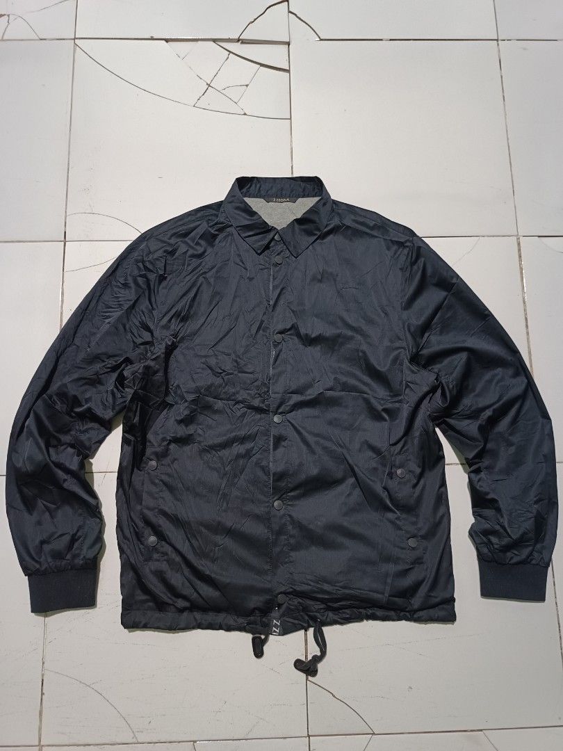Z Zegna Navy Coach Jacket XL (Category: Coats, Jackets and Outerwear) located in Barotac Nuevo. Submitted by gray101 (Listing ID 1464243390, Image 1). Description: - Navy blue Z Zegna coach jacket - Size XL - Snap button closure - Drawstring hem - Made in Romania - Ideal for layering - Please check photos for detailed condition.