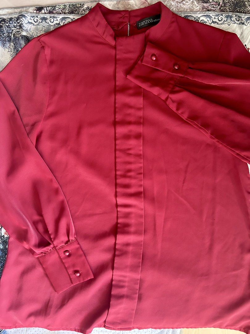 Zanzea Collection Red Button Cuff Mandarin Collar Blouse (Category: Blouses) located in Quezon City. Submitted by mississantis_modeoff (Listing ID 1464178789, Image 1). Description: - Red Zanzea Collection blouse - Elegant mandarin collar with back button closure - Long sleeves with button cuffs - Simple and classic design - Versatile for work outfits - Made from a smooth and flowy material.