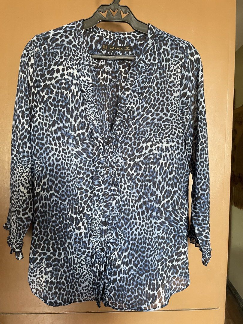 Zara Basic Blue Leopard Print Long Sleeve Blouse (Category: Longsleeves) located in Manila. Submitted by mochi_dear (Listing ID 1464166305, Image 1). Description: - Zara Basic blue and black leopard print blouse - Long sleeves with ruffled cuffs - V-neck with button details down the front - Lightweight material, perfect for layering or wearing alone - Effortlessly dress up or down.